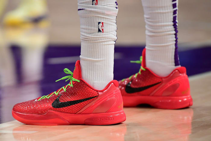 View of red and black Nike Kobe shoes.